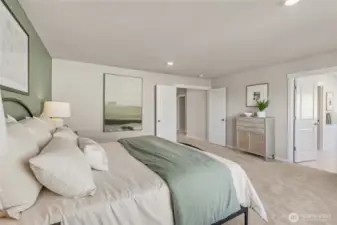 Primary bedroom spacious layout with access to the walk-in closet and ensuite bathroom. Double doors give it a very grand feel. Photos are representative only and may display different color package and/or upgrades.