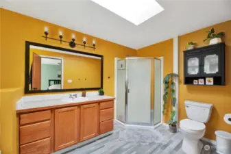 Walk in shower and large mirror in the primary bath