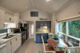 KITCHEN WITH PROPANE STOVE, MOCROWAVE AND REFRIGERATOR