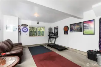 Oversized 2-car tandem garage can fit two cars or one car plus "man cave/gym."