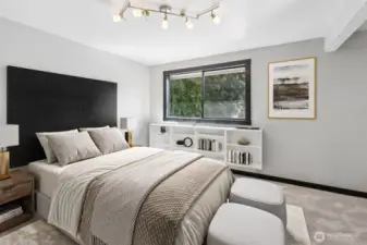 A generous primary suite with ensuite bath. This photo is virtually staged.