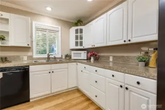 Spacious kitchen with crisp white cabinetry