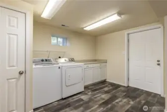 Laundry room with exterior door