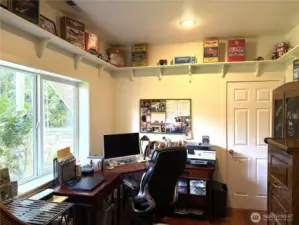Large window to watch wildlife and the waterfall. Door enters into the downstairs 3/4 bath.