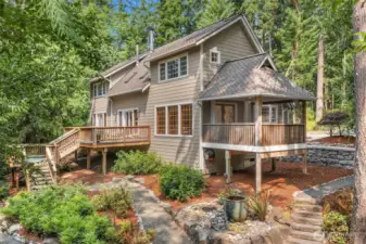 Surrounded by stately fir, cedar, and madrone the home enjoys Sierra Mountain vibes.