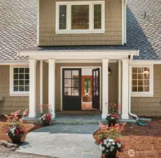 The formal front entrance makes you feel like you are entering your private mountain resort with unique columns, slate sidewalk and french doors.