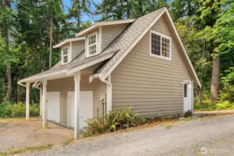 Stylish 2-car garage is ingeniously crafted to blend into the property with ease. The garage loft possesses dormer  windows and skylights to allow for year-round natural lighting.