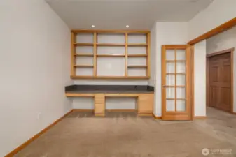 Front Guest Bedroom/Den/Office Area offers built-in office desk with granite countertop. Built-in shelving for your library too!