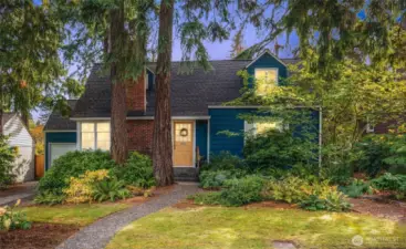 Storybook Cape Cod charm with classic dormers and timeless curb appeal.