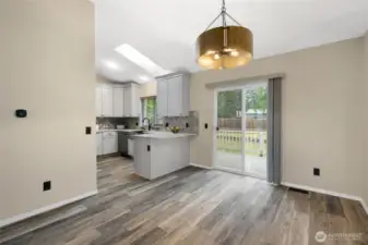 Dining room opens to Trex deck and backyard.