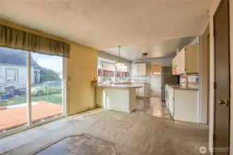 Eating space in the kitchen with sliding glass doors to the back deck