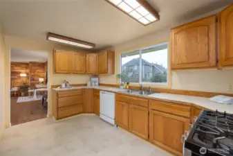 Another view of the kitchen with wood cabinetry.