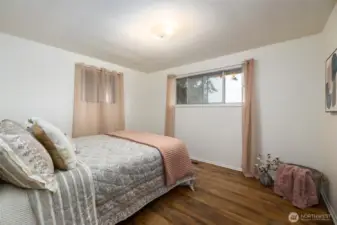 Bedroom number one offers 2 windows and hardwood flooring. All the bedrooms are fairly generous sized for a mid-century home.