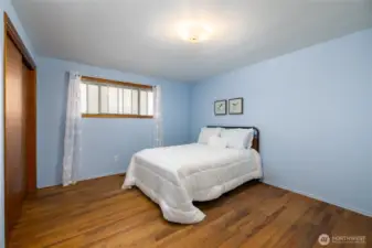 Bedroom number 2 is very spacious and has a large closet and also some built-ins and hardwood floors.