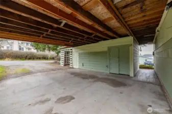 Nice, covered carport will easily accomodate 2 large cars.