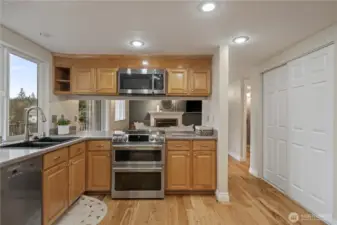 Induction cooktop and double oven, perfect for those larger gatherings. Optional bar seating or serving area.