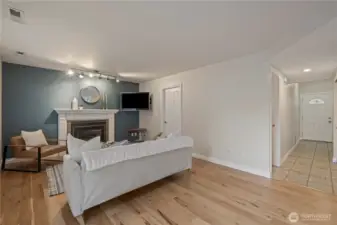 Family room, with laundry and front entry views.