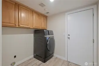 Laundry room accessed from the family room and two-car garage. Additional storage is a bonus!