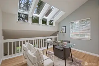 Open, second-level loft w/venting four pane sky wall windows that open to capture that morning light and afternoon breezes.