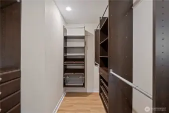 Walk-in closet in primary bedroom.
