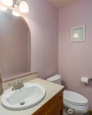 Half bath is off the hall between the den/office and eating area.