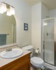 Three quarter bath between the two upstairs guest bedrooms.