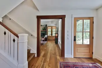 You back is to the entrance of the kitchen. The stairwell to the left brings you to rest of your home. We are going up. Watch the video to enjoy the beauty of the stairwell.