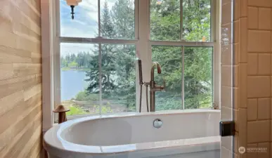 So much thought and care went into the design of this home. Here is your view from your spacious shower and deep soaking tub. No need for any blinds here, you have the privacy of the cedars and firs between you and your neighbors.
