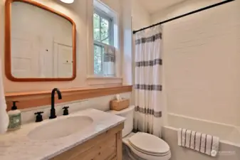 This full bath has a second door that connects to the lower level reading nook (that can also serve as another sweet place to sleep). You will see the nook in the floor plans and video.
