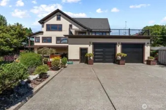 Large auto-court for off-street parking in addition to the two-car garage