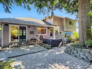 CHARMING TRAILS AND FLORAL SURPRISES THROUGHOUT THE BACK YARD.