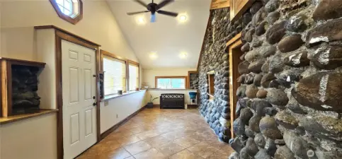Dramatic rock wall and wood finish work will impress your guests.
