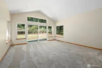 Beautiful primary suite with slider to back patio.