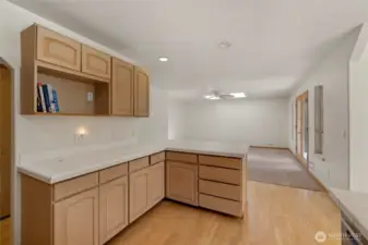 Open kitchen with so much counter space and hall pantry