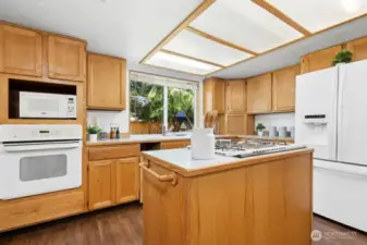 Solid oak cabinets could be nicely updated with paint, re-staining and contemporary hardware.