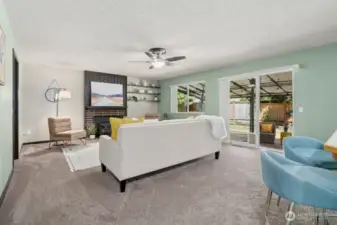 The large informal living room expands out to a covered patio for three season entertaining.