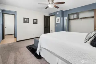 Ensuite primary bath with separation between vanity and the shower/toilet area.