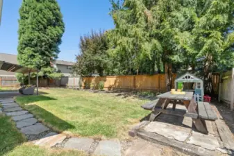 Large, level, fully fenced backyard!