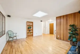 Another view of the main living room with the front door at the far end on the right