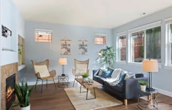 bright family room with gas fire place