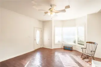 Large living room with beautiful bay window.
