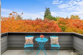 Tranquil private balcony overlooking lush foliage — a perfect spot to relax outdoors.