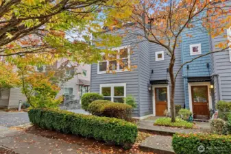 Two-car attached garage with alley access and low-maintenance exterior.