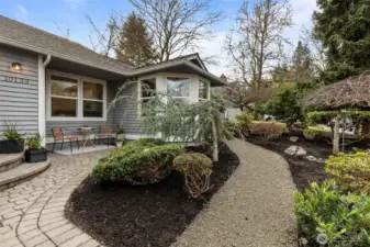 Lush, mature landscaping in front creates great curb appeal and welcomes you home.