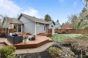 A spacious deck overlooks the fenced yard with ample room for BBQs, pets and play.