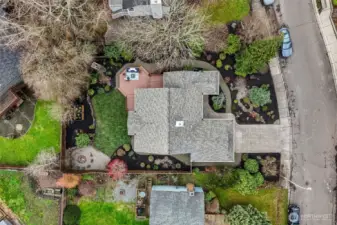 Aerial view of the park-like lot. Note that the full exterior of the home has been freshly repainted (as well as the interior).