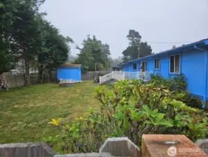Double lot with a fully fenced privacy backyard and a utility shed.