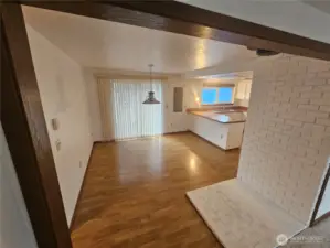 Dining area adjacent to the kitchen and sliding doors to the deck.