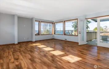 Living room - walk out french doors to spacious deck. Open both doors wide for indoor/outdoor entertaining!