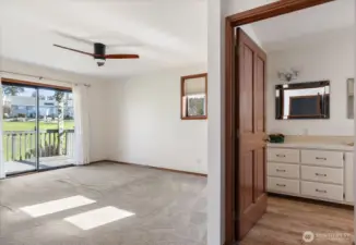 Primary bedroom, showing door to bathroom